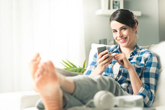 Woman using mobile at home