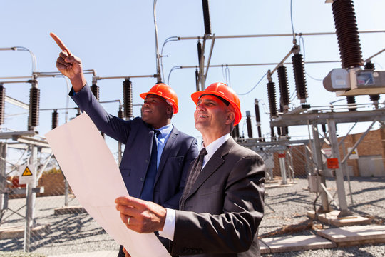 two inspectors working in electrical substation
