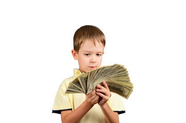 little boy looking at a stack of 100 US dollars bills and think