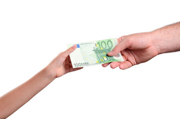 man's hand gives a the bill 100 euro in a child's hand