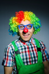 Funny clown against the dark background