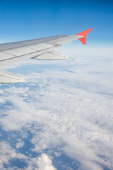 Obraz premium Airplane wing out of window