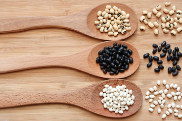 Beans in a wooden spoons