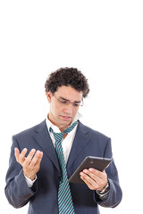 upset and tired man in suit uses tablet for online gambling