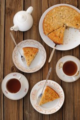 Old-fashioned apple pie with black tea