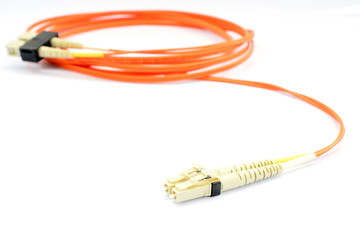 Close up of a fiber optic patchcord head over white background