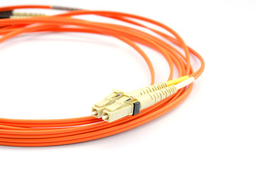 Close up of a fiber optic patchcord head over white background