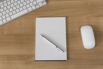 Desk with keyboard and Notepad