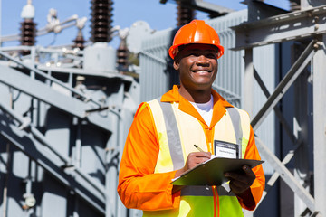young african technician working in substation