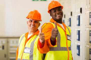 electrical engineers giving thumbs up