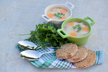 fish soup with brown bread and parsley