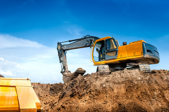 construction site digger, excavator and dumper truck. industrial