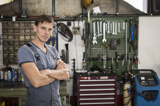 Portrait of car mechanic in garage