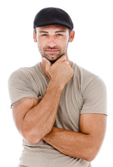Fototapeta premium Smiling young man with arms crossed.