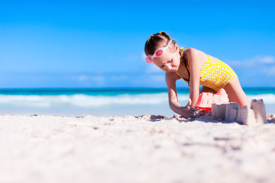 Little girl playing at beach