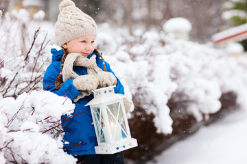 Little girl with Christmas lantern © TravelPhotoBloggers