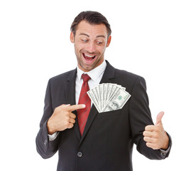 Smiling handsome businessman holding money