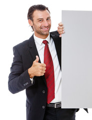 Smiling young business man holding a placard