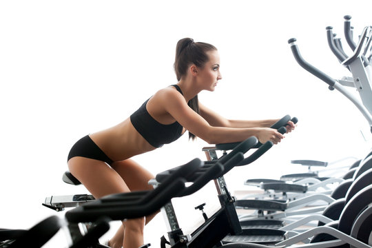 Image Of Sexy Woman Exercising On Stationary Bike