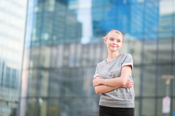 Young woman in modern glass office interior