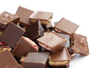 Pieces of chocolate filled with nuts and strawberry