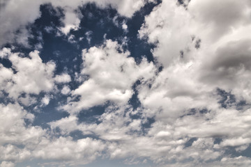 Background of blue sky with white clouds