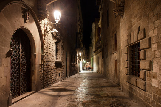 Fototapeta Street in Gothic Quarter of Barcelona at Night