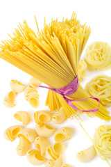 Mixed uncooked raw italian pasta with spaghetti
