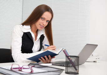business woman with notebook in the office