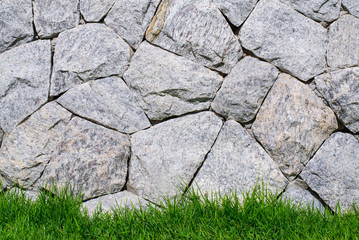 Stone Brick wall and green grass