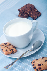 Cup of milk and cakes