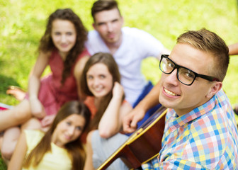 Friends having fun with guitar