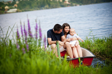 Family with baby on boat