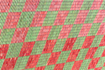Red-green background. Roof of old building.