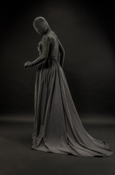 Woman wrapped in black robes