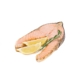 Fried salmon fillet with lemon and rosemary.