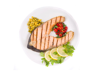 Grilled salmon steak with vegetables.