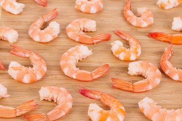 Boiled shrimps on cutting board.