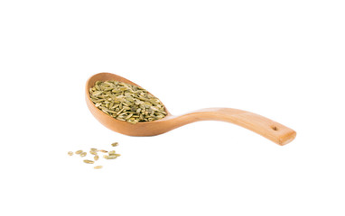 Spoon with pumpkin seeds.