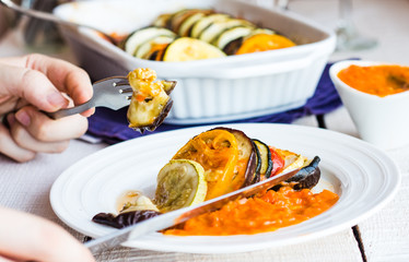 processes to eat vegetable ratatouille with a fork and knife, ha