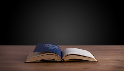 Open book on wooden deck