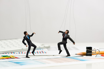 Business doll puppets on the desk