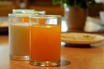 Orange juice and milk for breakfast