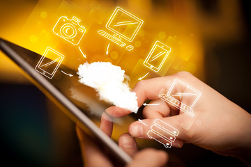 Finger pointing on tablet pc, mobile cloud concept