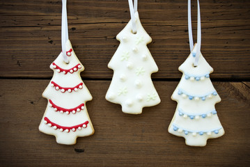 Three Christmas Tree Cookies on Wood