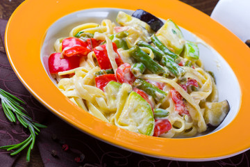 Italian vegetarian pasta with sauce and vegetables