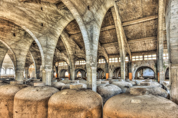 Concrete fermentation tanks in an abandoned cellar - 69205180