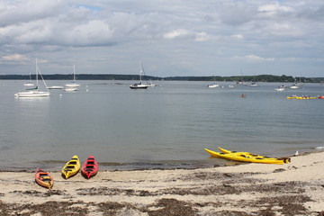 Naklejka premium kayaks on the beach
