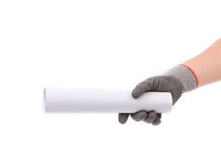 Hnd in gray glove holding paper roll.