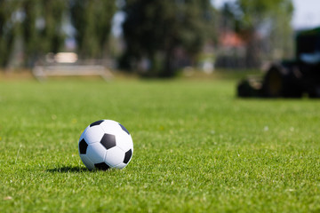 Green pitch with soccer ball © Mikkel Bigandt